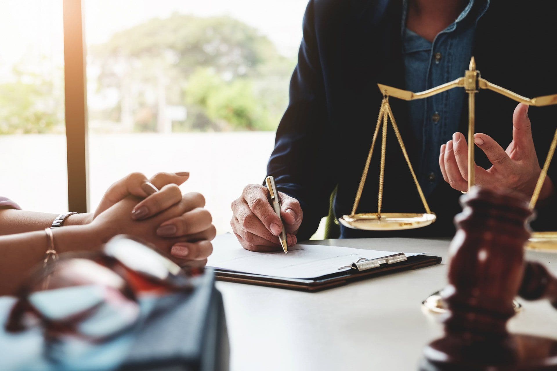 Attorney reviewing consultation documents with a client